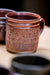 pottery mug decorated with japanese guild symbol stamps for clay relyef